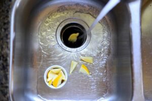 deodorize your garbage disposal with lemon